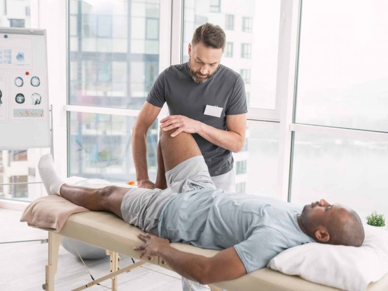 Rehabilitation,Therapy.,Professional,Male,Therapist,Working,In,The,Rehabilitation,Center Miami-Dade Orthopedic Doctor